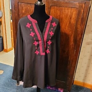 Woman Within Black Tunic with Pink Embroidery